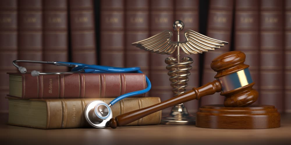 Gavel and stethoscope on table signifying Medical malpractice lawyers