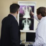 doctor examining x-ray